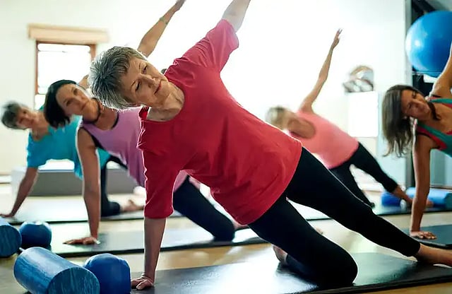 women performing pilates