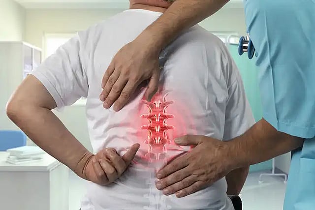 person getting spinal treatment on their back