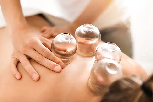 person receiving iastm and cupping treatment