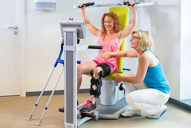 woman getting help with pre and post surgical rehab