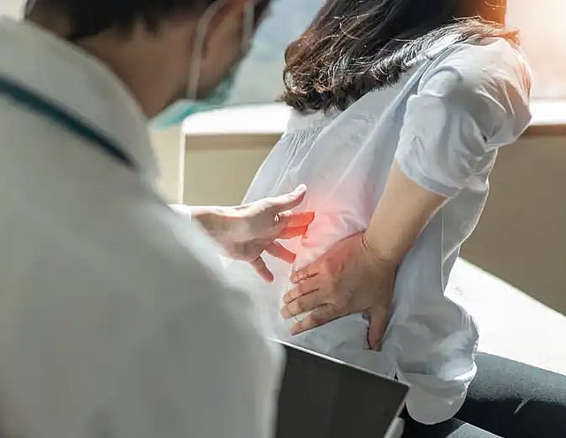 person getting help with neck and lower back pain
