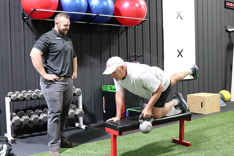 Balance and core strengthening exercise with a personal trainer at The barbell Club in Cody Wyoming