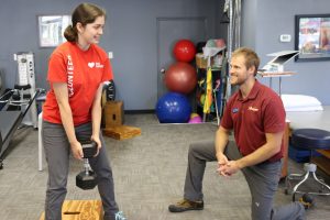 Patient lifting a weight at Advantage Rehab Physical Therapy in Cody, Wyoming